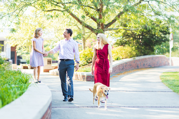 Todd Cutter walks outside with his wife, daughter and dog