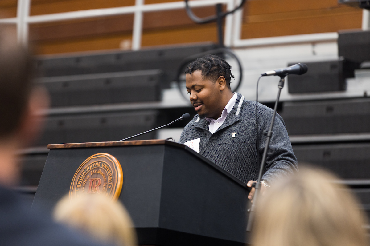 Cardo Grant stands at a podium