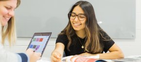 Geraldine Ledezma-Garcia talks with classmate in classroom