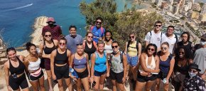 Summer Kindley poses with other study abroad students overlooking ocean in Span