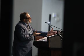 Michael Eric Dyson speaks behind a podium