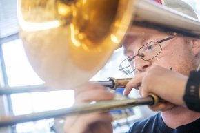 William Blair playing trombone