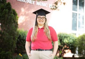 Tiffany Holman stands in front of Mauney Music Building