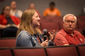 An LTSS alumna asks a question during the session in Belk Centrum