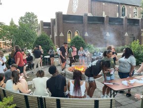 Students gather around the Grace Chapel fire pit during Welcome Weekend