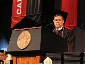 Dr. David Lowry giving a commencement speech.