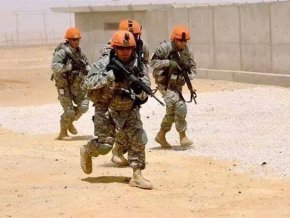 LR student Nikolai Patterson runs through a training exercise in the military.