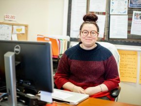 Yasmine Arevalo at her desk in the career center