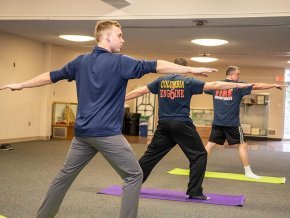 Firefighters doing yoga on the Columbia campus