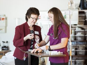 Hannah Fowler, right, works in a nursing lab with a faculty member, left