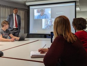 M.Div students and professor in class with students attending virtually over Zoom