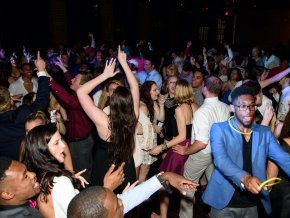 Students in formal attire dance