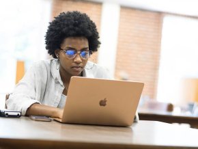 Student at computer in library