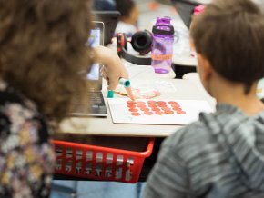 Teacher candidates working with students in literacy lab