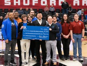 Theta Xi members present check to Habitat for Humanity of Catawba Valley