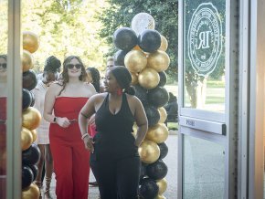 Students arrive in PE Monroe auditorium for the Student Life Awards