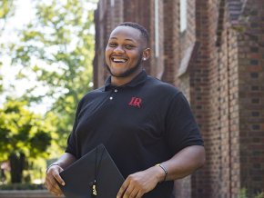 Dylan Foster stands in front of Mauney Hall