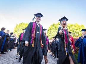 Class officers Diego Sanjuan and Bethany Perry lead the line of 2024 graduates