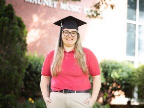 Tiffany Holman stands in front of Mauney Music Building