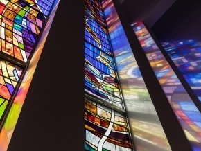 Closeup low angle of the stained glass panels in the LTSS chapel with the dove visible