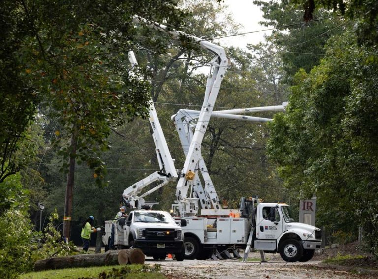 Utility crew cleaning up and repair electric lines near Hickory campus