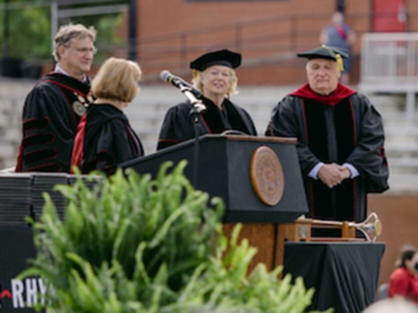 Hank and Bernice McCrorie on the graduation stage receiving their honorary degrees.