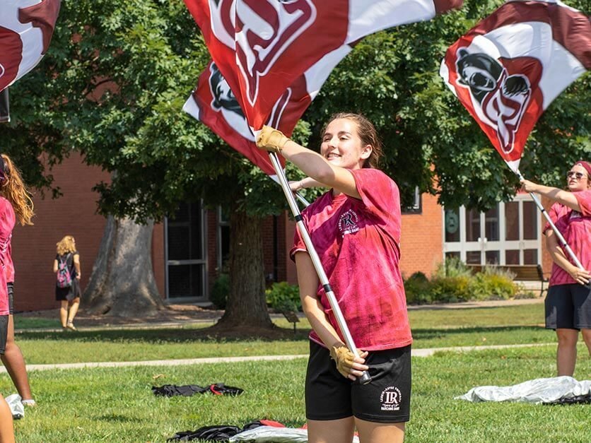 An LR student waving a Bears flag