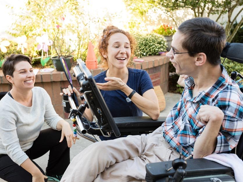 Occupational therapy assist a client during a site visit