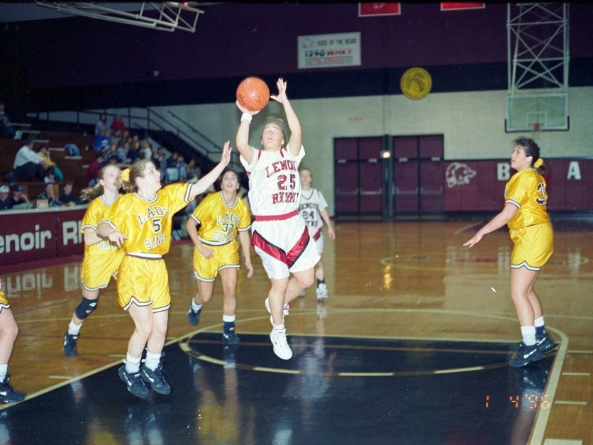 Chrissy Elliott prepares to throw the basketball into the hoop during a basketball game in the mid 1990s.