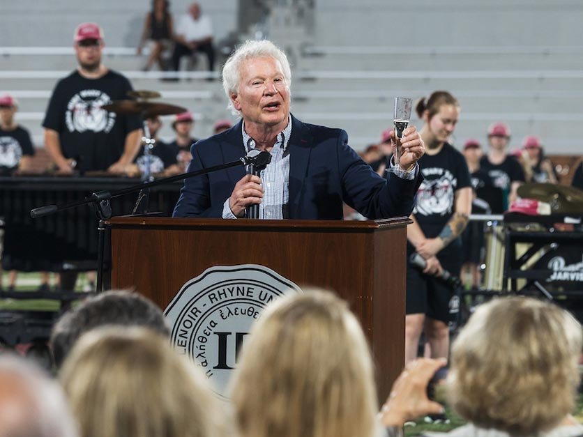 A toast on the field to the completion of the Moretz Stadium project