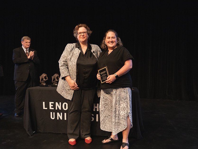 Alyssa Stewart being presented with award