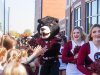 Joe Bear gives high fives to kids outside Moretz Stadium