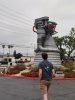 Caleb Knight with rocket engine monument