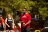 Ellis Horton wraps his wrist at an outdoor meet before a track and field event