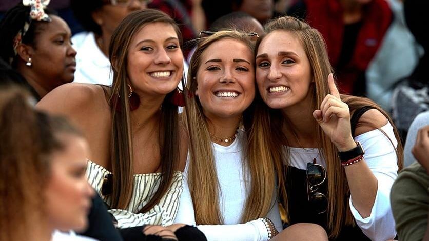 Friends smiling at a game